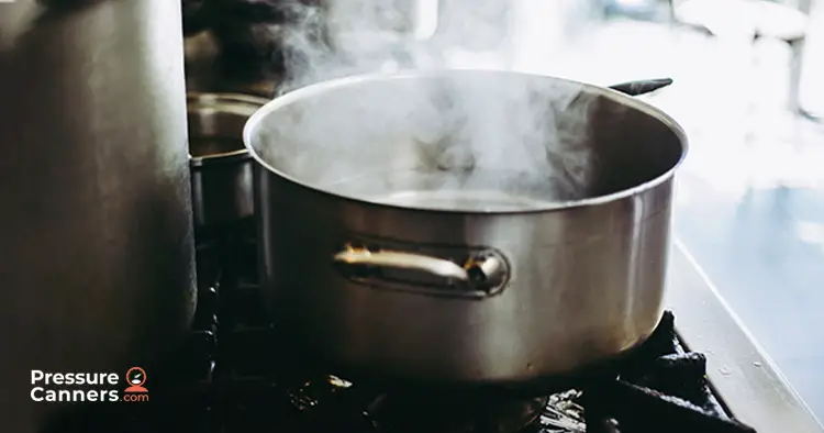 Water boiling on a stove in a pot
