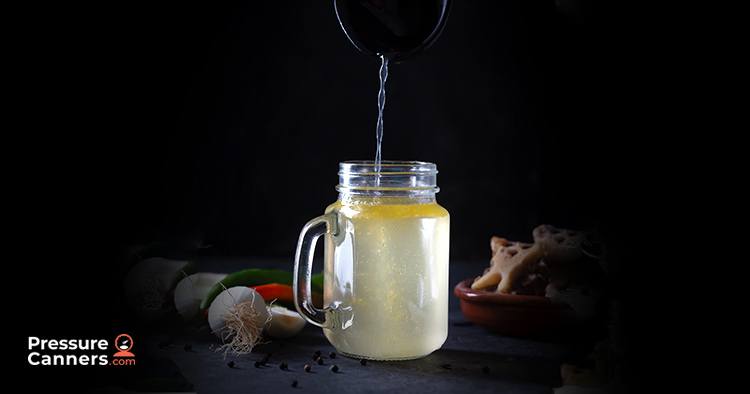 A glass jar being filled up.