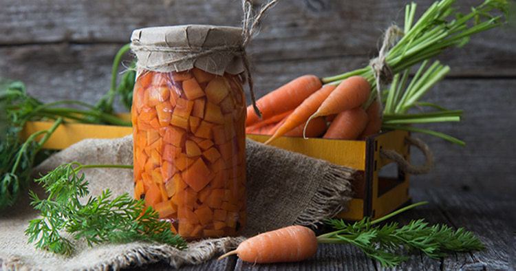 Fresh carrots in a glass jar,cooking vegetarian food.