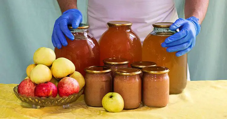 Man cuts off the peel of an apple. Conservation. Cooking apples