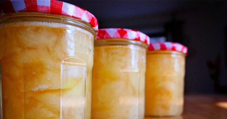 Home made apple compote in three colorful glasses