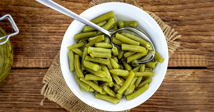 Portion of preserved Green Beans as detailed close-up shot