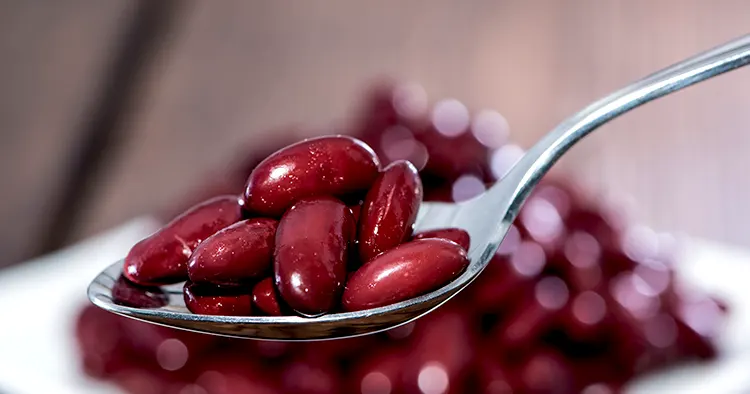 Kidney Beans on a Spoon with blurred portion in the background