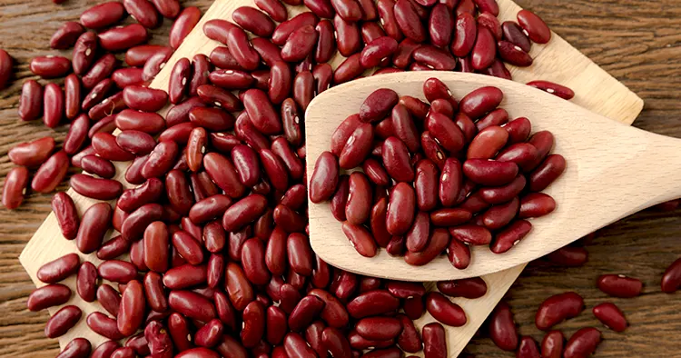 Red kidney beans in wooden spoon