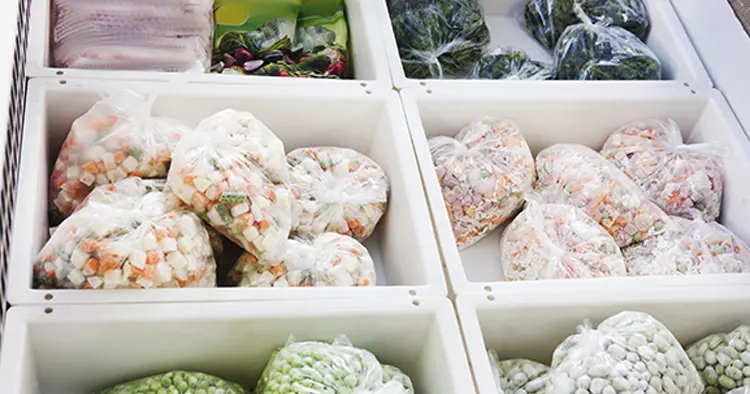 colorful frozen vegetables in a supermarket in the refrigerator