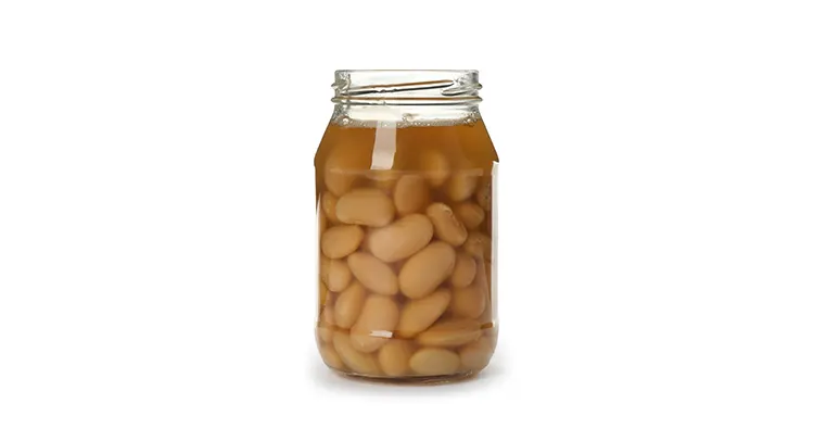 Jar of pickled beans isolated on white