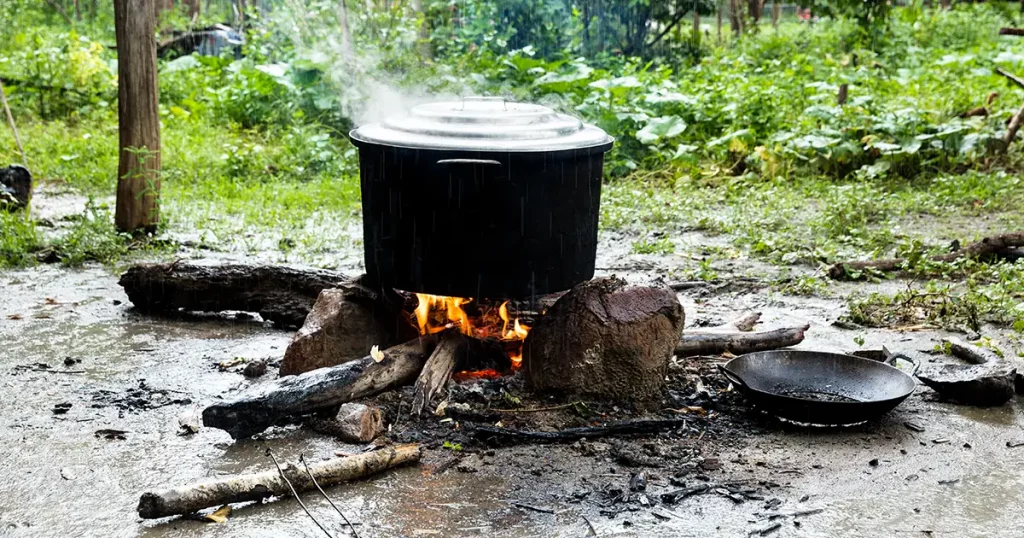 Image of rural cooking in the open. Traditional way of cooking in countryside.