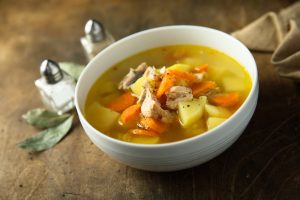 bowl of chicken soup with carrots